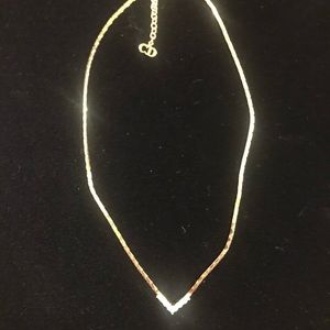 Classic disco era vintage Christian Dior
necklace with rhinestone “vee”
